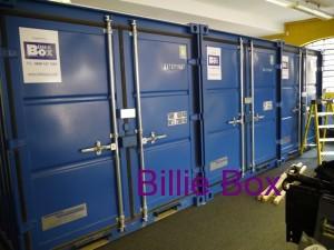 3 x 8ft storage containers inside a building