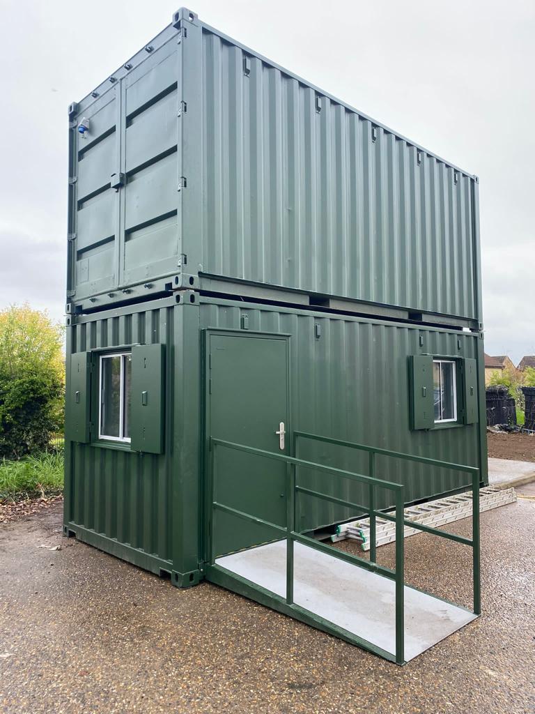 Front view of hospital site office and canteen converted shipping containers showing access ramp.