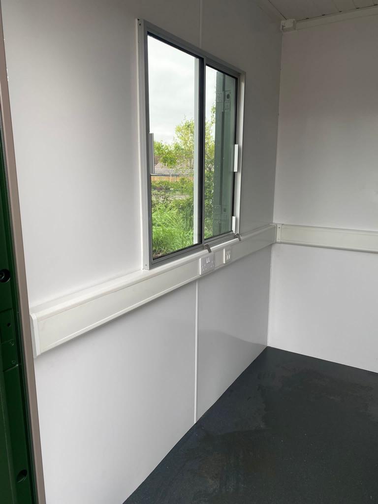 Interior of hospital site office and canteen converted shipping containers
